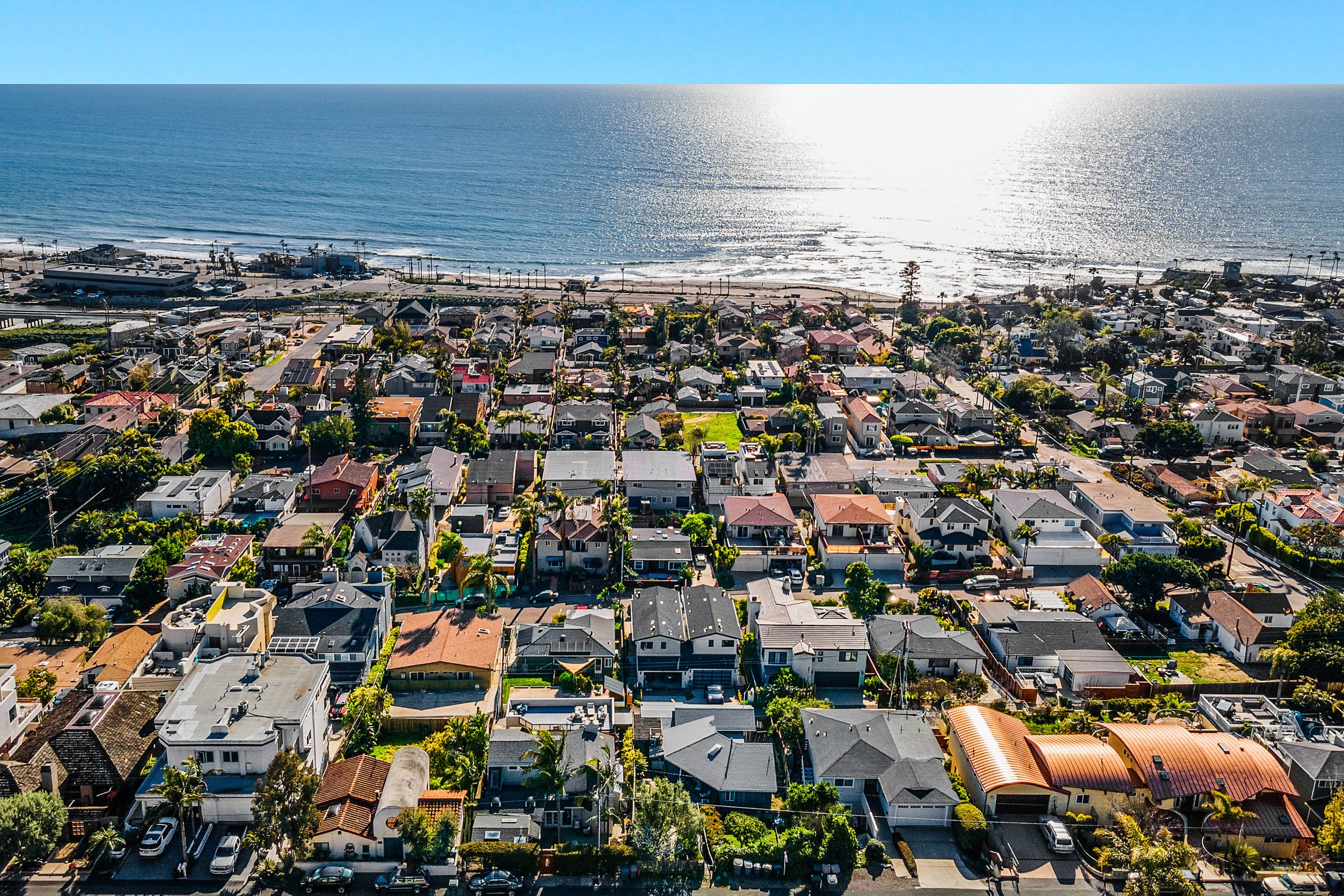 Aerial view of residential houses in Cardiff-by-the-Sea, California with ocean nearby