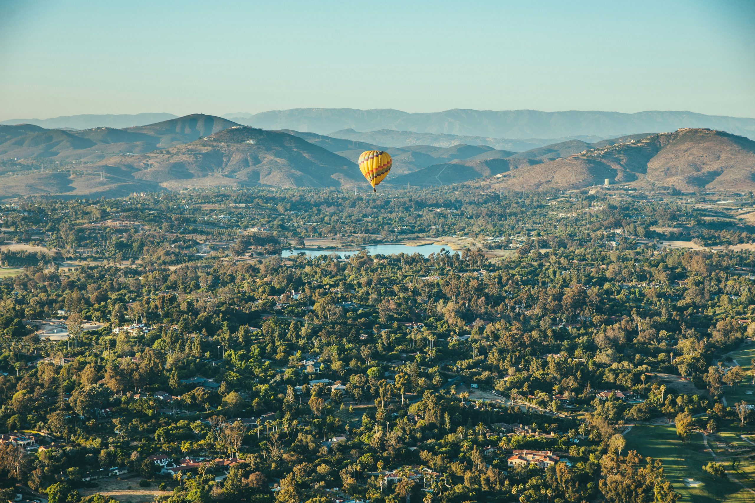 Hot air balloon over residential neighborhoods in Rancho Santa Fe, California